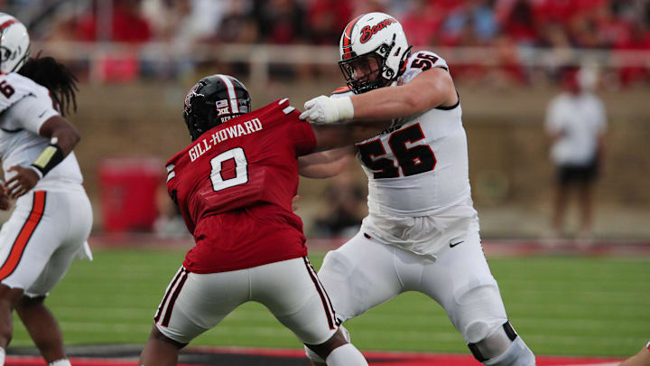 Sep 13, 2025; Lubbock, Texas, USA;  Texas Tech Red Raiders defensive tackle Skyler Gil-Howard (0) rushes against Oregon State Beavers offensive lineman Dylan Sikorski (56) in the second half at Jones AT&T Stadium. Mandatory Credit: Michael C. Johnson-Imagn Images