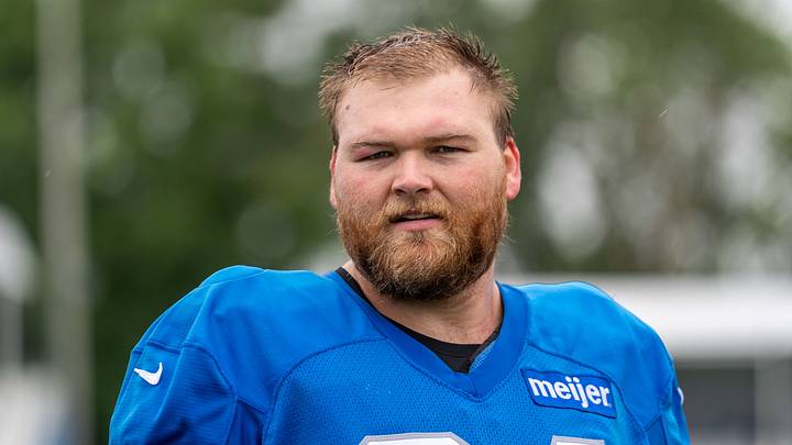 Detroit Lions center Cade Mays (64) looks on
