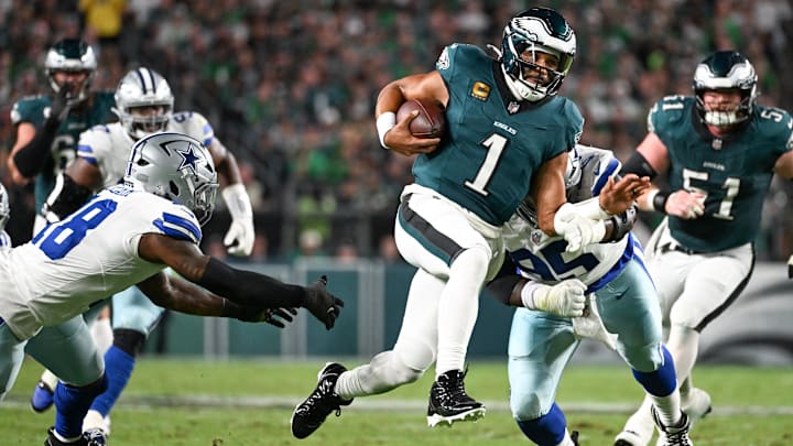 Philadelphia Eagles quarterback Jalen Hurts (1) avoids a tackle by Dallas Cowboys defensive tackle Kenny Clark (95) during the second quarter of the game at Lincoln Financial Field in Week 1.