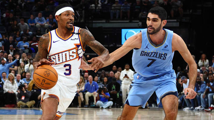 Feb 25, 2025; Memphis, Tennessee, USA; Phoenix Suns guard Bradley Beal (3) drives to the basket as Memphis Grizzlies forward Santi Aldama (7) defends during the fourth quarter at FedExForum. Mandatory Credit: Petre Thomas-Imagn Images