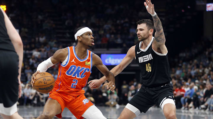 Mar 16, 2024; Memphis, Tennessee, USA; Oklahoma City Thunder guard Shai Gilgeous-Alexander (2) handles the ball as Memphis Grizzlies guard John Konchar (46) defends during the first half at FedExForum. Mandatory Credit: Petre Thomas-Imagn Images Mar 16, 2024; Memphis, Tennessee, USA; Oklahoma City Thunder guard Shai Gilgeous-Alexander (2) handles the ball as Memphis Grizzlies guard John Konchar (46) defends during the first half at FedExForum. Mandatory Credit: Petre Thomas-Imagn Images