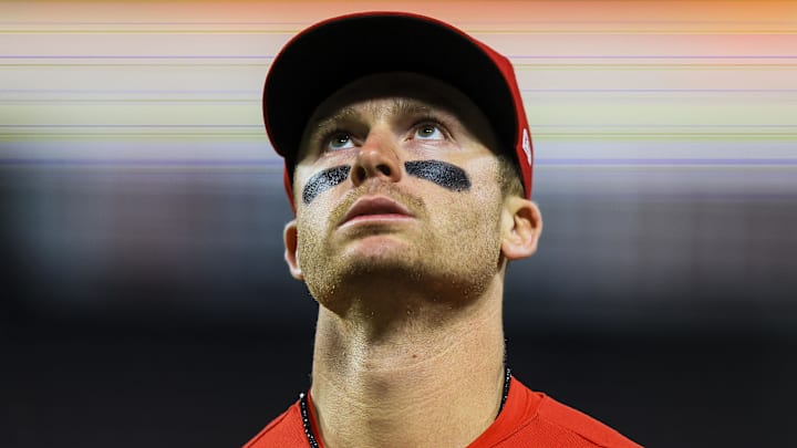 Cincinnati Reds second baseman Matt McLain (9) walks off the field