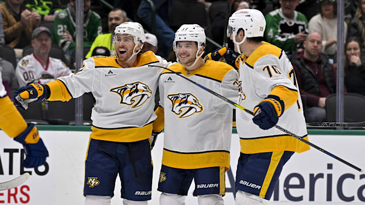 Dec 12, 2024; Dallas, Texas, USA; Nashville Predators right wing Jonathan Marchessault (81) and defenseman Nick Blankenburg (37) and defenseman Brady Skjei (76) celebrate during the game between the Dallas Stars and the Nashville Predators at American Airlines Center. Mandatory Credit: Jerome Miron-Imagn Images