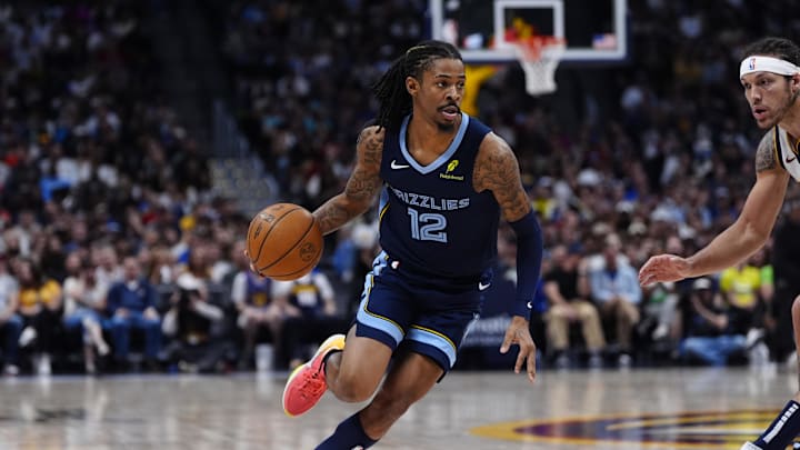 Apr 11, 2025; Denver, Colorado, USA; Memphis Grizzlies guard Ja Morant (12) drives to the basket in the second quarter against the Denver Nuggets at Ball Arena. Mandatory Credit: Ron Chenoy-Imagn Images Apr 11, 2025; Denver, Colorado, USA; Memphis Grizzlies guard Ja Morant (12) drives to the basket in the second quarter against the Denver Nuggets at Ball Arena. Mandatory Credit: Ron Chenoy-Imagn Images
