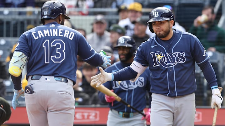 Apr 19, 2026; Pittsburgh, Pennsylvania, USA;  Tampa Bay Rays first baseman Jonathan Aranda (right) greets  third baseman Junior Caminero (13) crossing home plate on a solo home run against the Pittsburgh Pirates during the ninth inning at PNC Park.