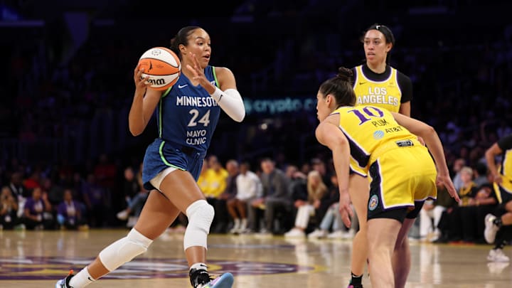 May 18, 2025; Los Angeles, California, USA;  Minnesota Lynx forward Napheesa Collier (24) drives to the basket against Los Angeles Sparks guard Kelsey Plum (10) during the first quarter at Crypto.com Arena. Mandatory Credit: Kiyoshi Mio-Imagn Images