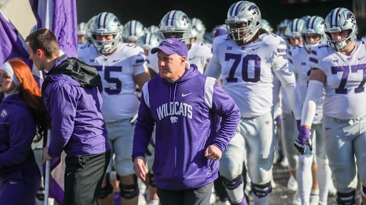 Nov 19, 2022; Morgantown, West Virginia, USA; Kansas State Wildcats head coach Chris Klieman leads his team onto the field prior to their game against the West Virginia Mountaineers at Mountaineer Field at Milan Puskar Stadium. Mandatory Credit: Ben Queen-USA TODAY Sports