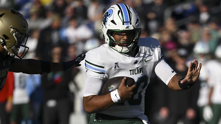 Nov 16, 2024; Annapolis, Maryland, USA; Tulane Green Wave quarterback Darian Mensah (10) rusheds during the second half against the Navy Midshipmen at Navy-Marine Corps Memorial Stadium. Nov 16, 2024; Annapolis, Maryland, USA; Tulane Green Wave quarterback Darian Mensah (10) rusheds during the second half against the Navy Midshipmen at Navy-Marine Corps Memorial Stadium.