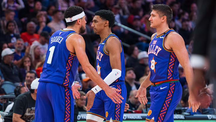 Dec 15, 2024; Phoenix, Arizona, USA; Phoenix Suns guard Devin Booker (1) celebrates with forward Ryan Dunn (0) and guard Grayson Allen (8) in the second half during a game against the Portland Trail Blazers at Footprint Center. Mandatory Credit: Allan Henry-Imagn Images Dec 15, 2024; Phoenix, Arizona, USA; Phoenix Suns guard Devin Booker (1) celebrates with forward Ryan Dunn (0) and guard Grayson Allen (8) in the second half during a game against the Portland Trail Blazers at Footprint Center. Mandatory Credit: Allan Henry-Imagn Images