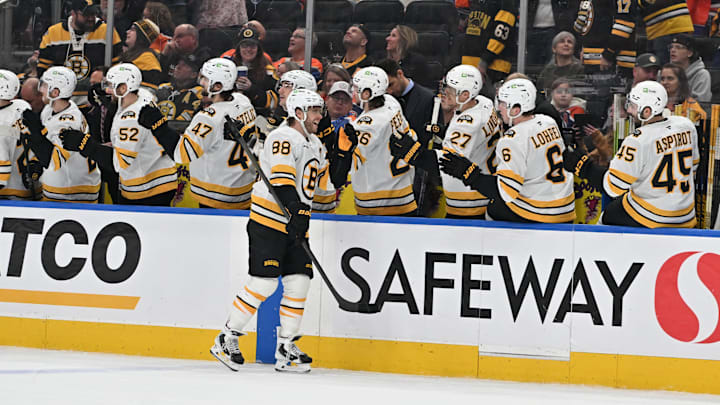 Dec 31, 2025; Edmonton, Alberta, CAN; Boston Bruins right winger David Pastrnak (88) celebrates a goal with team mates in the third period against the Edmonton Oilers at Rogers Place. Mandatory Credit: Walter Tychnowicz-Imagn Images