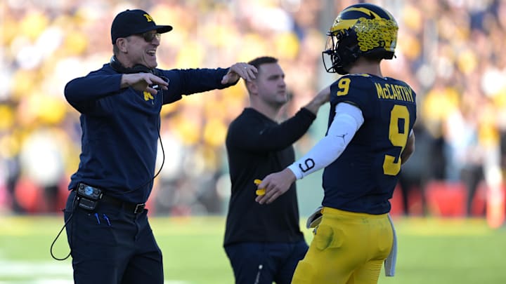 Jan 1, 2024; Pasadena, CA, USA; Michigan Wolverines head coach Jim Harbaugh (left) congratulates
