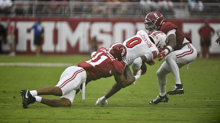 Aug 31, 2024; Tuscaloosa, Alabama, USA;  Alabama Crimson Tide linebacker Jihaad Campbell (11) and defensive back DeVonta Smith (8) combine to stop Western Kentucky Hilltoppers Kisean Johnson (0) during the first half at Bryant-Denny Stadium. Mandatory Credit: Gary Cosby Jr.-Imagn Images