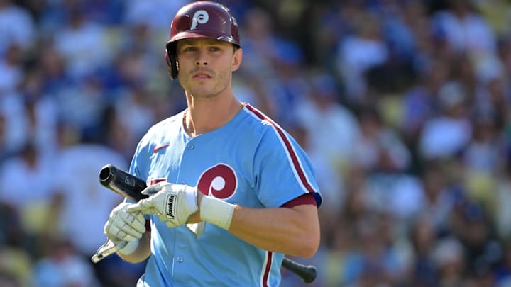 Oct 9, 2025; Los Angeles, California, USA; Philadelphia Phillies catcher J.T. Realmuto (10) reacts after striking out in the second inning against the Los Angeles Dodgers during game four of the NLDS round for the 2025 MLB playoffs at Dodger Stadium.