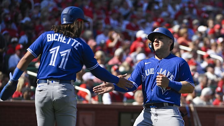 Mar 30, 2023; St. Louis, Missouri, USA; Toronto Blue Jays left fielder Daulton Varsho (25) celebrates with shortstop Bo Bichette (11) after they both scored against the St. Louis Cardinals during the first inning at Busch Stadium. Mar 30, 2023; St. Louis, Missouri, USA; Toronto Blue Jays left fielder Daulton Varsho (25) celebrates with shortstop Bo Bichette (11) after they both scored against the St. Louis Cardinals during the first inning at Busch Stadium.