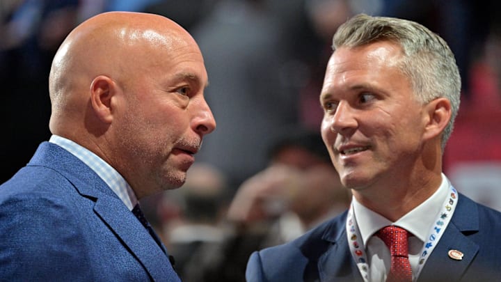 Jul 7, 2022; Montreal, Quebec, CANADA; Montreal Canadiens general manager Kent Hughes (left) talks with head coach Martin St. Louis before the first round of the 2022 NHL Draft at Bell Centre. Mandatory Credit: Eric Bolte-Imagn Images
