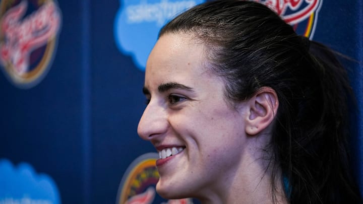 Indiana Fever guard Caitlin Clark (22) smiles while answering a question Tuesday, Sept. 17, 2024, after an Indiana Fever practice at Gainbridge Fieldhouse in Indianapolis.