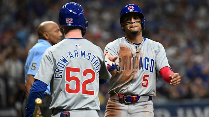 Jun 11, 2024; St. Petersburg, Florida, USA; Chicago Cubs third baseman Christopher Morel (5) celebrates with center fielder Pete Crow-Armstrong (52) after scoring a run in the sixth inning against the Tampa Bay Rays at Tropicana Field.