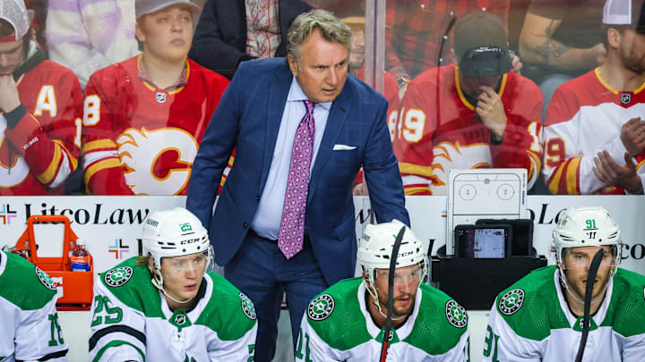 May 3, 2022; Calgary, Alberta, CAN; Dallas Stars head coach Rick Bowness on his bench during the first period against the Calgary Flames in game one of the first round of the 2022 Stanley Cup Playoffs at Scotiabank Saddledome. Mandatory Credit: Sergei Belski-Imagn Images