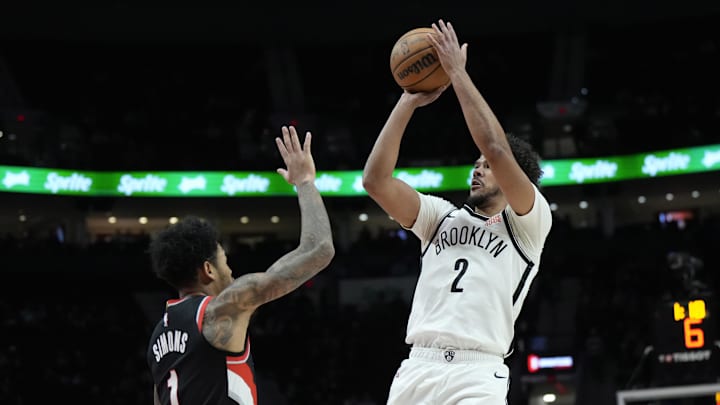 Jan 14, 2025; Portland, Oregon, USA; Brooklyn Nets small forward Cameron Johnson (2) shoots the ball over Portland Trail Blazers shooting guard Anfernee Simons (1) during the first half at Moda Center. Mandatory Credit: Soobum Im-Imagn Images Jan 14, 2025; Portland, Oregon, USA; Brooklyn Nets small forward Cameron Johnson (2) shoots the ball over Portland Trail Blazers shooting guard Anfernee Simons (1) during the first half at Moda Center. Mandatory Credit: Soobum Im-Imagn Images
