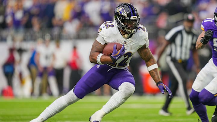 Baltimore Ravens running back Derrick Henry (22) runs against the Minnesota Vikings in the fourth quarter at U.S. Bank Stadium.