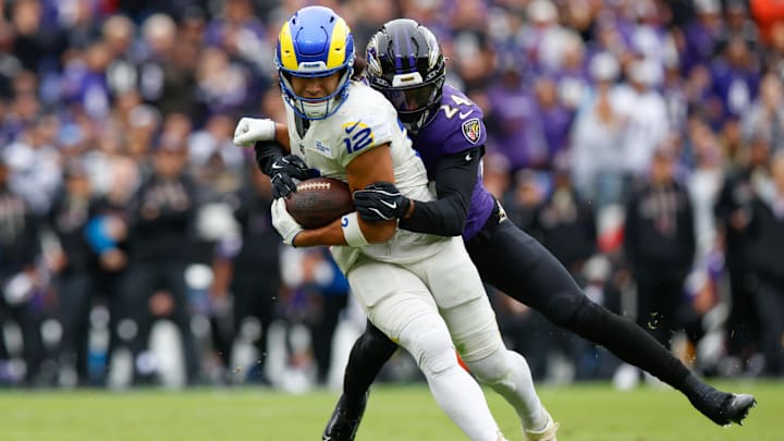 Oct 12, 2025; Baltimore, Maryland, USA; Baltimore Ravens safety Malaki Starks (24) tackles Los Angeles Rams wide receiver Puka Nacua (12) during the second quarter of the game at M&T Bank Stadium. Mandatory Credit: Peter Casey-Imagn Images Oct 12, 2025; Baltimore, Maryland, USA; Baltimore Ravens safety Malaki Starks (24) tackles Los Angeles Rams wide receiver Puka Nacua (12) during the second quarter of the game at M&T Bank Stadium. Mandatory Credit: Peter Casey-Imagn Images