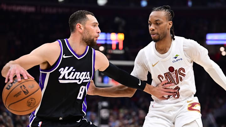 Apr 6, 2025; Cleveland, Ohio, USA; Sacramento Kings guard Zach LaVine (8) drives to the basket against Cleveland Cavaliers guard Darius Garland (10) during the first half at Rocket Arena.