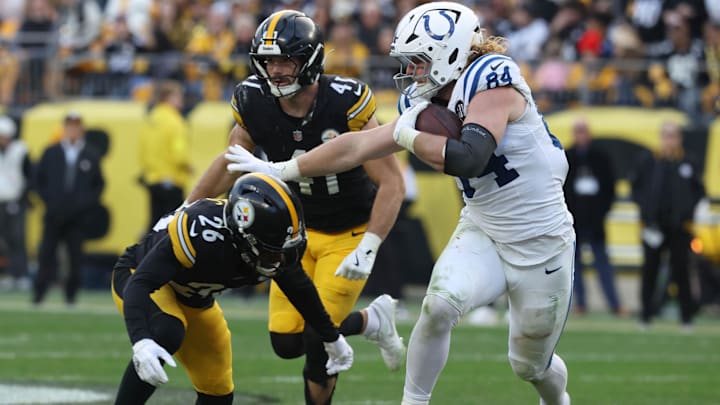 Nov 2, 2025; Pittsburgh, Pennsylvania, USA; Indianapolis Colts tight end Tyler Warren (84) runs after a catch as Pittsburgh Steelers linebacker Payton Wilson (41) and cornerback Brandin Echols (26) defend during the fourth quarter at Acrisure Stadium. Mandatory Credit: Charles LeClaire-Imagn Images Nov 2, 2025; Pittsburgh, Pennsylvania, USA; Indianapolis Colts tight end Tyler Warren (84) runs after a catch as Pittsburgh Steelers linebacker Payton Wilson (41) and cornerback Brandin Echols (26) defend during the fourth quarter at Acrisure Stadium. Mandatory Credit: Charles LeClaire-Imagn Images