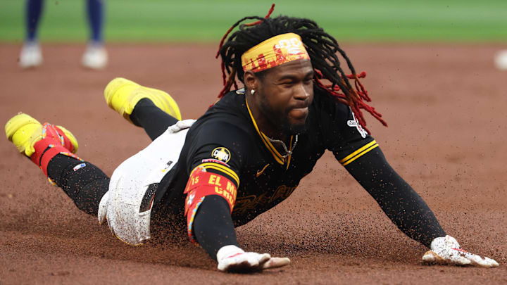 Sep 16, 2025; Pittsburgh, Pennsylvania, USA; Pittsburgh Pirates center fielder Oneil Cruz (15) slides into third base on an RBI triple against the Chicago Cubs during the first inning at PNC Park. Mandatory Credit: Charles LeClaire-Imagn Images
