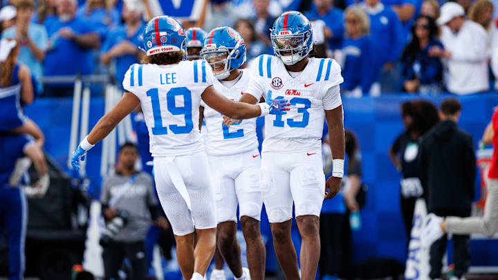 Sep 6, 2025; Lexington, Kentucky, USA; Mississippi Rebels quarterback Austin Simmons (13) celebrates with wide receiver Cayden Lee (19) after scoring a touchdown during the third quarter against the Kentucky Wildcats at Kroger Field. Mandatory Credit: Jordan Prather-Imagn Images