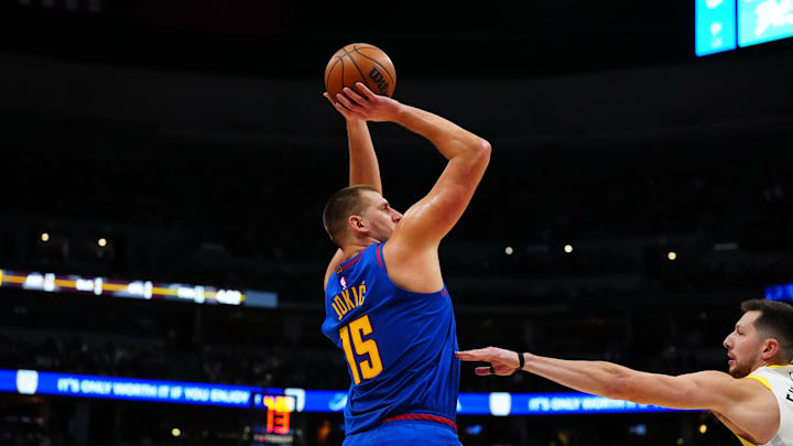 Nov 2, 2024; Denver, Colorado, USA; Denver Nuggets center Nikola Jokic (15) shoots the ball in the third quarter against the Utah Jazz at Ball Arena. 