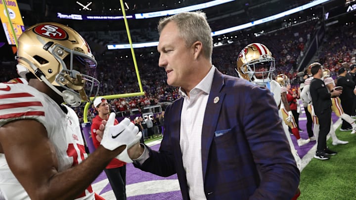 San Francisco 49ers wide receiver Jauan Jennings (L) and general manager John Lynch (R)