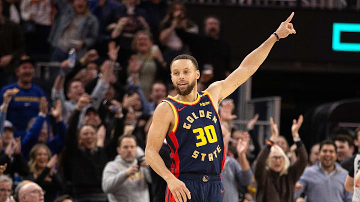 Mar 13, 2025; San Francisco, California, USA; Golden State Warriors guard Stephen Curry (30) celebrates his 4,000th career 3-point basket during the third quarter against the Sacramento Kings at Chase Center. Mandatory Credit: D. Ross Cameron-Imagn Images