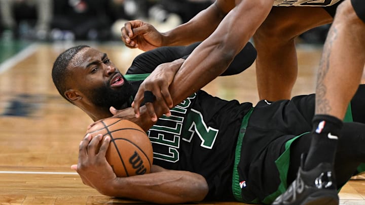 Jan 10, 2026; Boston, Massachusetts, USA; Boston Celtics guard Jaylen Brown (7) and San Antonio Spurs forward Harrison Barnes (40) battle for the ball during the second half at the TD Garden. Mandatory Credit: Brian Fluharty-Imagn Images
