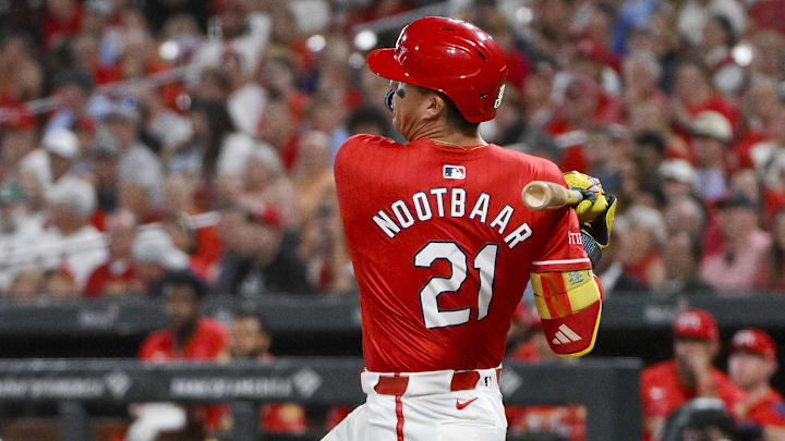 Sep 19, 2025; St. Louis, Missouri, USA;  St. Louis Cardinals left fielder Lars Nootbaar (21) hits a one run single against the Milwaukee Brewers during the first inning at Busch Stadium. Mandatory Credit: Jeff Curry-Imagn Images
