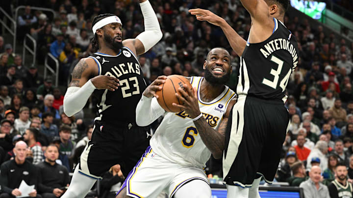 Dec 2, 2022; Milwaukee, Wisconsin, USA; Los Angeles Lakers forward LeBron James (6) drives to the basket against Milwaukee Bucks forward Giannis Antetokounmpo (34) in the second half at Fiserv Forum. Mandatory Credit: Michael McLoone-Imagn Images