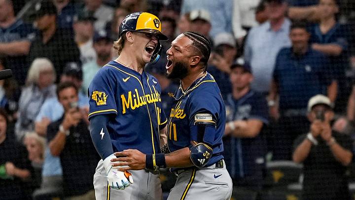 Cooper Pratt (left) launched a 12th-inning homer in Game 4 of the World Series that briefly put the Brewers on the brink of a championship.