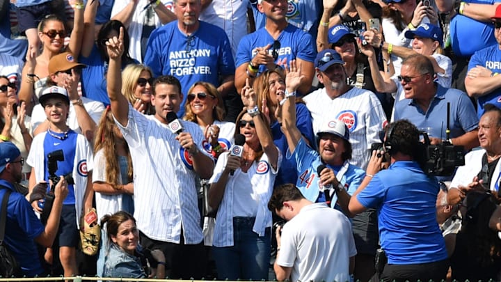 Chicago Cubs team ambassador Anthony Rizzo, Cindy Crawford, and Eddie Vedder sing the seventh inning stretch.
