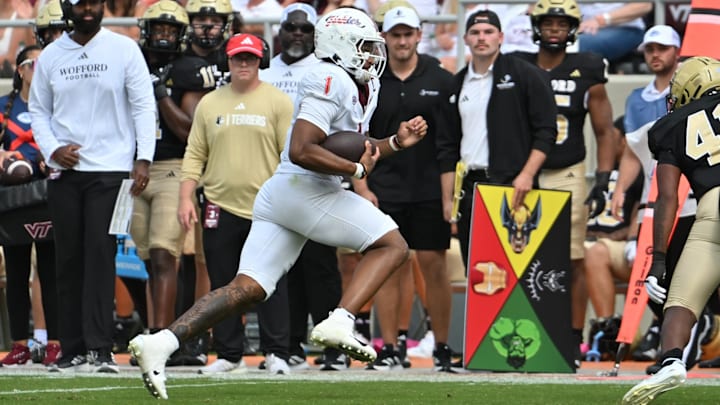 Sep 20, 2025; Blacksburg, Virginia, USA; Virginia Tech Hokies quarterback Kyron Drones (1) runs the ball during the third quarter against the Wofford Terriers at Lane Stadium. Mandatory Credit: Brian Bishop-Imagn Images Sep 20, 2025; Blacksburg, Virginia, USA; Virginia Tech Hokies quarterback Kyron Drones (1) runs the ball during the third quarter against the Wofford Terriers at Lane Stadium. Mandatory Credit: Brian Bishop-Imagn Images
