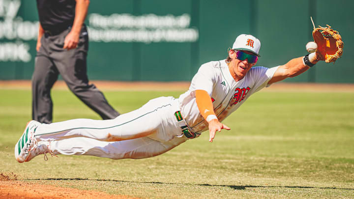 Miami Hurricanes second baseman Jake Ogden making a great catch against Lehigh. Miami Hurricanes second baseman Jake Ogden making a great catch against Lehigh.