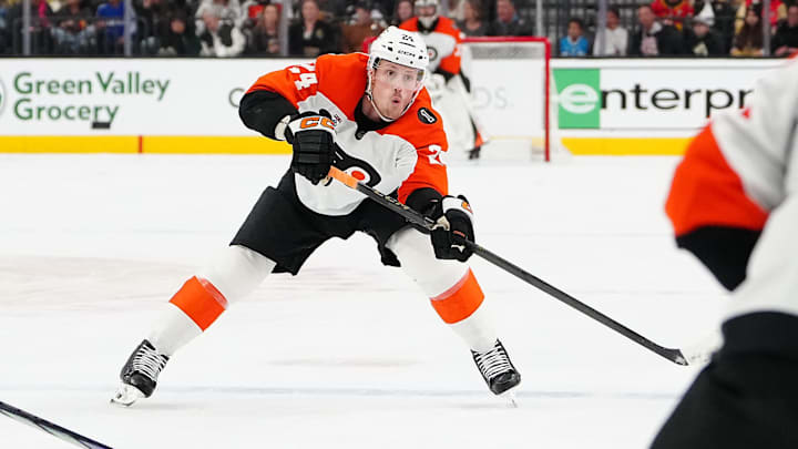 Jan 19, 2026; Las Vegas, Nevada, USA; Philadelphia Flyers defenseman Nick Seeler (24) passes the puck to Philadelphia Flyers right wing Travis Konecny (11) during a power play against the Vegas Golden Knights in the second period at T-Mobile Arena.