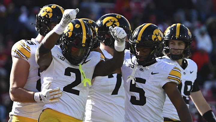 Nov 23, 2024; College Park, Maryland, USA; Iowa Hawkeyes running back Kaleb Johnson (2) celebrates after scoring a touchdown during the first half against the Maryland Terrapins at SECU Stadium. Mandatory Credit: Tommy Gilligan-Imagn Images Nov 23, 2024; College Park, Maryland, USA; Iowa Hawkeyes running back Kaleb Johnson (2) celebrates after scoring a touchdown during the first half against the Maryland Terrapins at SECU Stadium. Mandatory Credit: Tommy Gilligan-Imagn Images