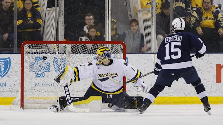 March 8, 2025; Ann Arbor, Michigan, USA; Penn State forward Charlie Cerrato (15) scores a penalty goal against Michigan Wolverines goalie Logan Stein (1) during the third period at Yost Ice Arena. 