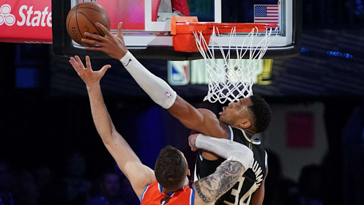 Dec 17, 2024; Las Vegas, Nevada, USA; Oklahoma City Thunder center Isaiah Hartenstein (55) and Milwaukee Bucks forward Giannis Antetokounmpo (34) fight for a rebound during the 4th quarter of the Emirates NBA Cup championship game at T-Mobile Arena. Mandatory Credit: Kyle Terada-Imagn Images