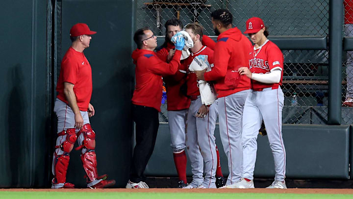 Aug 31, 2025; Houston, Texas, USA; Los Angeles Angels trainers attend to Los Angeles Angels left fielder Taylor Ward (3) after he sustained an injury while attempting to field a ball hit by Houston Astros second baseman Ramon Urias (29, not shown) during the eighth inning at Daikin Park. Mandatory Credit: Erik Williams-Imagn Images Aug 31, 2025; Houston, Texas, USA; Los Angeles Angels trainers attend to Los Angeles Angels left fielder Taylor Ward (3) after he sustained an injury while attempting to field a ball hit by Houston Astros second baseman Ramon Urias (29, not shown) during the eighth inning at Daikin Park. Mandatory Credit: Erik Williams-Imagn Images