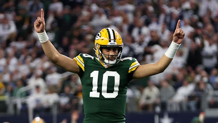 Jan 14, 2024; Arlington, Texas, USA; Green Bay Packers quarterback Jordan Love (10) reacts after a touchdown against the Dallas Cowboys in the first quarter for the 2024 NFC wild card game at AT&T Stadium. Mandatory Credit: Tim Heitman-Imagn Images