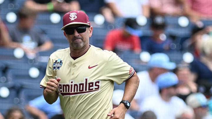 Jun 18, 2024; Omaha, NE, USA; Florida State Seminoles head coach Link Jarrett heads to the dugout before a game against the North Carolina Tar Heels at Charles Schwab Field Omaha. Mandatory Credit: Steven Branscombe-Imagn Images