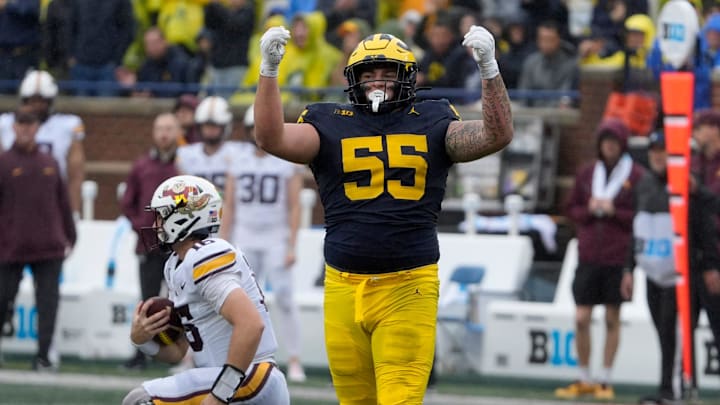 Michigan defensive lineman Mason Graham celebrates after sacking Minnesota quarterback Max Brosmer, in the background, during first-half action between Michigan and Minnesota at Michigan Stadium in Ann Arbor on Saturday, Sept. 28, 2024. Michigan defensive lineman Mason Graham celebrates after sacking Minnesota quarterback Max Brosmer, in the background, during first-half action between Michigan and Minnesota at Michigan Stadium in Ann Arbor on Saturday, Sept. 28, 2024.