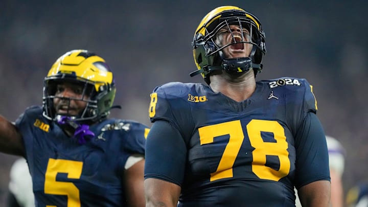 Michigan defensive lineman Kenneth Grant celebrates a sack on Washington quarterback Michael Penix Jr. during the College Football Playoff national championship game against Washington at NRG Stadium in Houston, Texas, on Monday, Jan. 8, 2024.