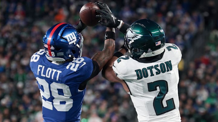 New York Giants cornerback Cor'Dale Flott (28) intercepts the pass intended for Philadelphia Eagles wide receiver Jahan Dotson (2) during the fourth quarter of the game at MetLife Stadium.