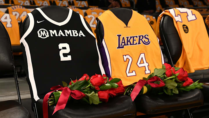 Jan 31, 2020; Los Angeles, California, USA;  Roses and the jerseys of Los Angeles Lakers Kobe Bryant, right, and his daughter Gianna are set on the seats they sat in on the last game they attended together, Dec. 29, 2019, at Staples Center. Mandatory Credit: Jayne Kamin-Oncea-Imagn Images
